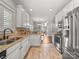 Kitchen with granite countertops, stainless steel appliances, and open access to the adjacent dining area at 1169 Stuarts Landing Dr, Cramerton, NC 28032