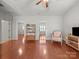 Open living room layout showcasing hardwood floors, neutral walls, and a comfortable seating area at 1169 Stuarts Landing Dr, Cramerton, NC 28032