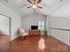 Bright and airy living room with hardwood floors, vaulted ceilings, and a ceiling fan at 1169 Stuarts Landing Dr, Cramerton, NC 28032