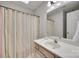 Functional bathroom featuring a shower, a vanity, and a shower curtain at 12004 Woodholm Ct, Tega Cay, SC 29708