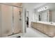 Modern bathroom with glass shower and double sink vanity at 12004 Woodholm Ct, Tega Cay, SC 29708