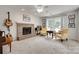 Relaxing living room with a brick fireplace, ample lighting, and comfortable seating at 12004 Woodholm Ct, Tega Cay, SC 29708