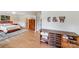 Inviting bedroom with wood floors and a built-in dresser, seamlessly connecting the sleeping and storage spaces at 12416 Stirling Trace Ct, Charlotte, NC 28277