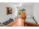 Bedroom with a wood bed frame, hardwood floors, and natural lighting at 12416 Stirling Trace Ct, Charlotte, NC 28277