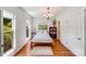 Bright bedroom with hardwood floors, modern furnishings, and natural light at 12416 Stirling Trace Ct, Charlotte, NC 28277