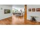 Bright kitchen with island, pendant lights, hardwood floors, and stainless steel appliances at 12416 Stirling Trace Ct, Charlotte, NC 28277