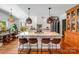 Kitchen island with seating and pendant lighting in a bright, open space at 12416 Stirling Trace Ct, Charlotte, NC 28277