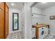 Laundry room with modern washer and dryer, sink and butcher block top at 12416 Stirling Trace Ct, Charlotte, NC 28277
