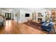 Spacious living room with hardwood floors, fireplace, custom built-ins, and plenty of seating at 12416 Stirling Trace Ct, Charlotte, NC 28277