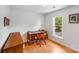 Bright office space with wood floors, desk, chair, and a view of the outdoors at 12416 Stirling Trace Ct, Charlotte, NC 28277