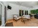 Partially covered patio with ceiling fans, outdoor seating, and mounted TV at 12416 Stirling Trace Ct, Charlotte, NC 28277