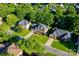 Aerial view of neighborhood homes with lush greenery, lawns, and tree-lined streets at 12434 Sylvan Oak Way, Charlotte, NC 28273
