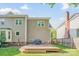 Back of house shows deck, grill, and backyard at 12434 Sylvan Oak Way, Charlotte, NC 28273