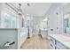 Modern bathroom with dual sinks, a walk-in shower, and a standalone tub with bronze fixtures at 12434 Sylvan Oak Way, Charlotte, NC 28273