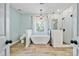 Bright bathroom with a standalone tub, walk-in shower, and elegant fixtures at 12434 Sylvan Oak Way, Charlotte, NC 28273
