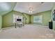 Spacious bonus room with lots of windows and a ceiling fan at 12434 Sylvan Oak Way, Charlotte, NC 28273