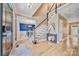 Bright foyer featuring hardwood floors, staircase, chandelier, and view into the dining room at 12434 Sylvan Oak Way, Charlotte, NC 28273