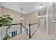 Upstairs hallway with neutral walls, white trim, and modern lighting at 12434 Sylvan Oak Way, Charlotte, NC 28273