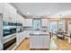 Bright kitchen with white cabinetry, stainless steel appliances, granite countertops, and eat-in area at 12434 Sylvan Oak Way, Charlotte, NC 28273