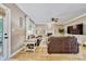 Inviting living room with leather sofas, fireplace, ceiling fan and French doors to outdoor living at 12434 Sylvan Oak Way, Charlotte, NC 28273