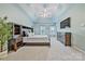 Spacious main bedroom featuring tray ceilings, fan, large windows, and ample storage space at 12434 Sylvan Oak Way, Charlotte, NC 28273