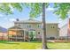 Rear exterior view with screened porch, patio and deck, and large backyard at 12434 Sylvan Oak Way, Charlotte, NC 28273