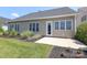 Landscaped backyard featuring lush green lawn and planting beds at 14019 Cameryn Elise Dr, Cornelius, NC 28031