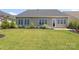 Beautiful backyard featuring a well-manicured lawn and landscaping at 14019 Cameryn Elise Dr, Cornelius, NC 28031
