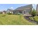 Expansive backyard with green lawn, mulched beds, and lovely landscaping at 14019 Cameryn Elise Dr, Cornelius, NC 28031