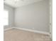 Cozy bedroom with carpet, a window, and neutral walls at 14019 Cameryn Elise Dr, Cornelius, NC 28031