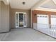 Covered front porch leading to a white framed front door at 14019 Cameryn Elise Dr, Cornelius, NC 28031
