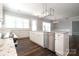Bright kitchen featuring stainless steel appliances, granite countertops, and a central island at 14019 Cameryn Elise Dr, Cornelius, NC 28031