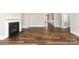 Living area featuring dark wood floors, a fireplace, and white trim at 14019 Cameryn Elise Dr, Cornelius, NC 28031