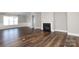 Living area with dark wood floors, fireplace, and white trim at 14019 Cameryn Elise Dr, Cornelius, NC 28031