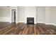 Living area with dark wood floors, fireplace, and white trim at 14019 Cameryn Elise Dr, Cornelius, NC 28031