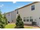 Manicured backyard featuring a tidy lawn and lush evergreens providing privacy and beauty at 14027 Clayborn St, Midland, NC 28107