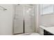 Bathroom with glass enclosed shower and built-in shelving for storage at 14027 Clayborn St, Midland, NC 28107