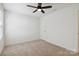 Bedroom with neutral carpet, ceiling fan, and a window letting in natural light at 14027 Clayborn St, Midland, NC 28107