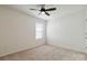 This is a bedroom with neutral carpet, ceiling fan, and window letting in natural light at 14027 Clayborn St, Midland, NC 28107
