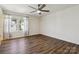Bright bedroom with hardwood floors, ceiling fan and natural light from the windows at 14027 Clayborn St, Midland, NC 28107