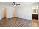 Spacious bedroom with hardwood floors, ceiling fan and ensuite bathroom at 14027 Clayborn St, Midland, NC 28107