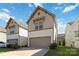 Two-story home featuring an attached garage, with a well-kept lawn and landscaping at 14027 Clayborn St, Midland, NC 28107
