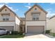Two-story home showcasing an attached garage, complimented by a well-maintained lawn at 14027 Clayborn St, Midland, NC 28107