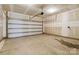 Spacious two-car garage with an automatic door ready for your personal touches and storage at 14027 Clayborn St, Midland, NC 28107