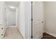 Hallway with carpeted flooring, white walls, and multiple doors at 14027 Clayborn St, Midland, NC 28107