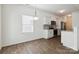 Dining area adjacent to a modern kitchen with stainless steel appliances and hardwood floors at 14027 Clayborn St, Midland, NC 28107