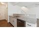 Kitchen area with stainless steel dishwasher, granite counters, and white cabinets at 14027 Clayborn St, Midland, NC 28107