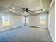 Spacious bedroom with tray ceilings, ceiling fan and natural light from the three windows at 1445 Mocksville Hwy # 26, Statesville, NC 28625