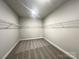 Empty walk-in closet with a carpeted floor, wire shelving, and neutral paint, ready for customization at 1445 Mocksville Hwy # 26, Statesville, NC 28625