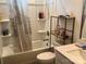 Bathroom with a vanity, toilet, shower with curtain, and storage shelves at 15005 Savannah Hall Dr # 72, Charlotte, NC 28273